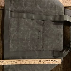Calvin Klein overnight bag in gray.